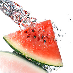 Image showing watermelon and water splash isolated on white