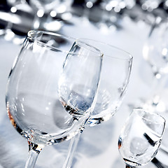 Image showing Three glass goblets on white table