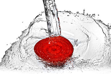 Image showing red beet with water splash isolated on white