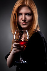 Image showing woman with red hair holding wine glass