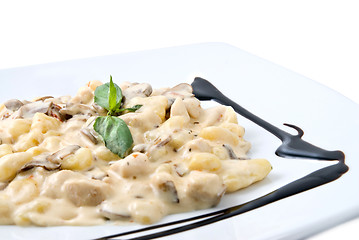 Image showing meat under white sauce on the plate