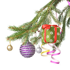 Image showing Christmas balls, gift and decoration on fir tree branch isolated