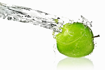 Image showing fresh water splash on green apple isolated on white