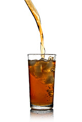 Image showing Poring cola into glass isolated on white