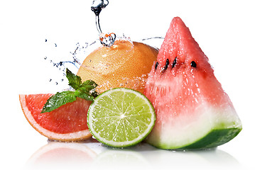Image showing Water splash on fresh fruits isolated on white