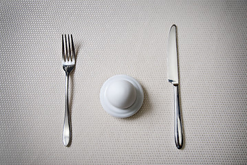 Image showing One egg with knife and fork