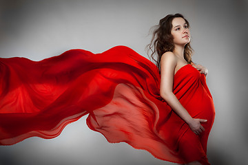 Image showing Pregnant woman in red dress 