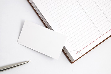 Image showing Empty business card with diary and pen isolated on white