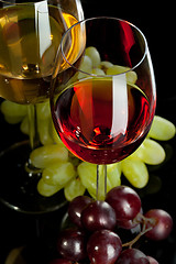 Image showing Red and white wine in glasses with grape. Top view