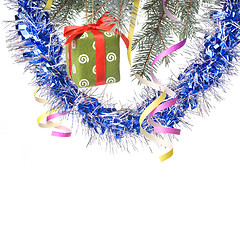 Image showing Christmas gift and decoration on fir tree branch isolated on whi