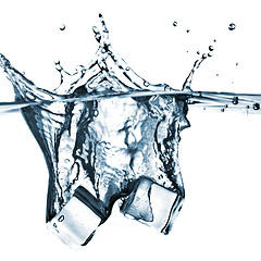 Image showing ice cubes dropped into water with splash isolated on white