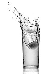 Image showing water splash in glass isolated on white