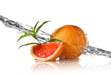 Image showing Water splash on grapefruit with mint isolated on white