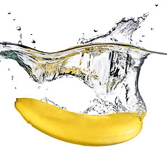 Image showing banana dropped into water isolated on white