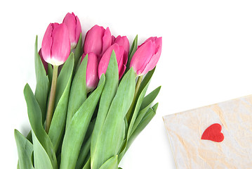 Image showing close-up pink tulips with gift isolated on white