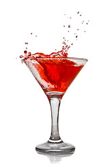 Image showing Red cocktail with splash isolated on white