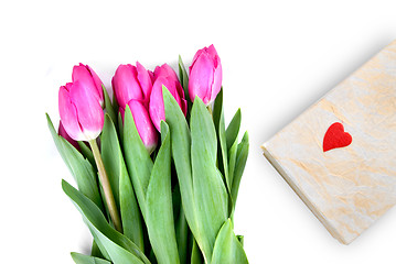 Image showing close-up pink tulips with gift isolated on white