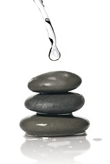 Image showing Spa stones with water splash isolated on white