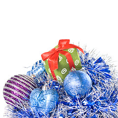 Image showing christmas balls with and gift with decoration isolated on white