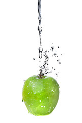 Image showing fresh water splash on green apple isolated on white