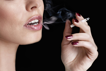 Image showing glamour smoking girl