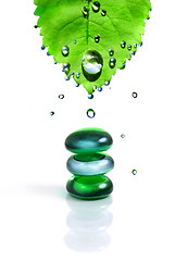 Image showing balancing spa shiny stones with leaf and water drops isolated on