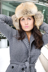 Image showing winter portrait of young woman in fur hat