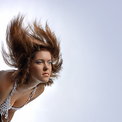 Image showing young woman with hair in motion