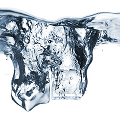 Image showing ice cubes dropped into water with bubbles isolated on white