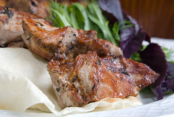 Image showing fried meat with potherbs on the plate