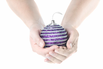 Image showing hands holding blue christmas pink isolated on white