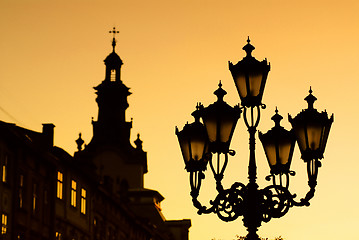 Image showing silhouettes of city lantern on the sunset