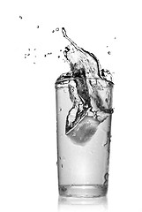 Image showing water splash in glass isolated on white