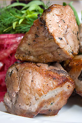 Image showing fried meat with potherbs on the plate