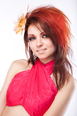 Image showing Portrait of beautiful woman with spring flower in hair on white