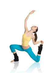 Image showing beautiful girl doing gymnastics on white background