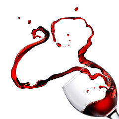 Image showing Heart from pouring red wine in goblet isolated on white