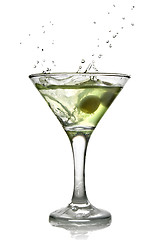 Image showing Green alcohol cocktail with splash isolated on white