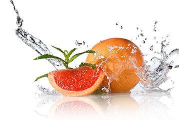 Image showing Water splash on grapefruit with mint isolated on white