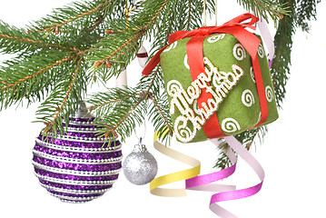 Image showing Christmas balls, gift and decoration on fir tree branch isolated