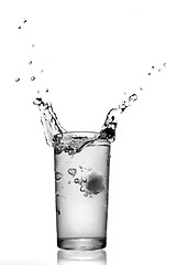 Image showing water splash in glass isolated on white