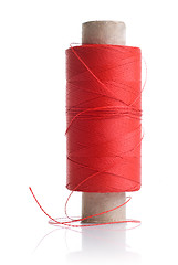 Image showing red thread and coil isolated on white