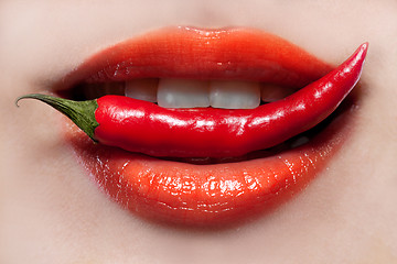 Image showing Woman lips and chili pepper