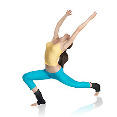 Image showing attractive woman doing gymnastics on white background