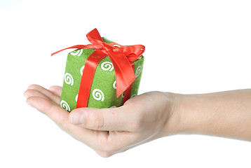 Image showing Hand holding gift isolated on white