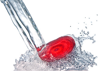 Image showing red beet with water splash isolated on white