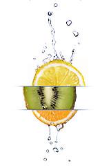 Image showing mix from lemon, orange and kiwi with fresh water drops isolated 