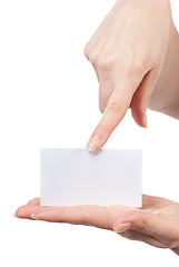 Image showing Womans hands holding and pointing empty visiting card isolated o