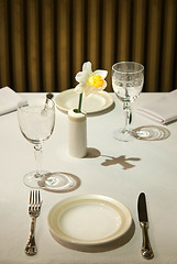 Image showing served table in restaurant with flower