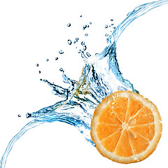 Image showing Fresh orange dropped into water with splash isolated on white